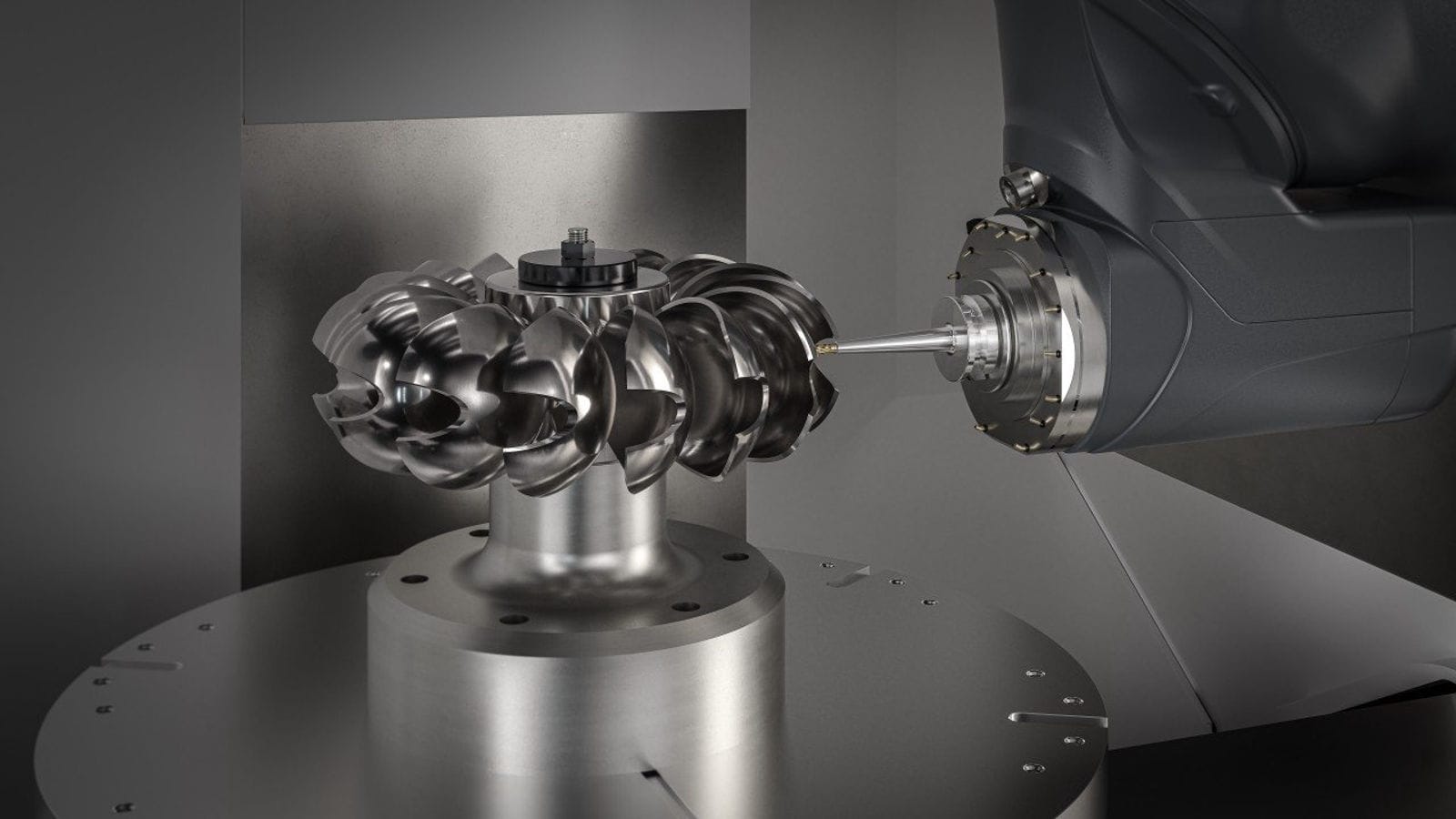 An automated 5-axis CNC machining cell with robotic part handling and AI monitoring systems.